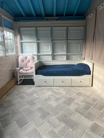 a living room with a couch and window