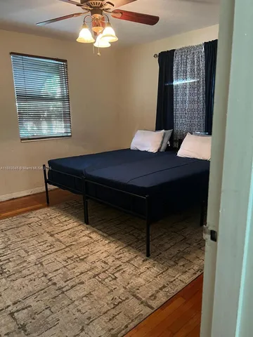 a room with a table and a chandelier