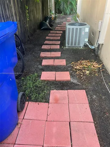 a view of a yard with chairs