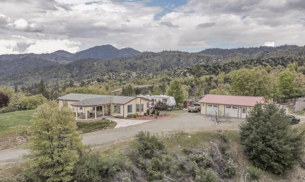 a view of houses with outdoor space and lakeside