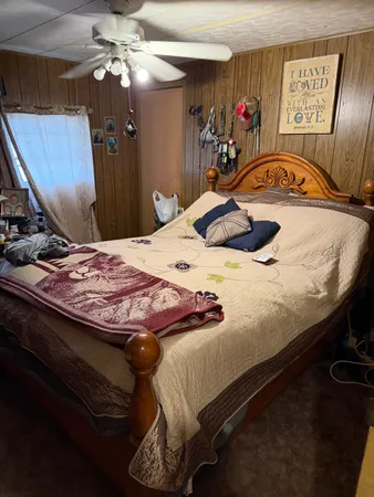 a bedroom with a bed and a closet