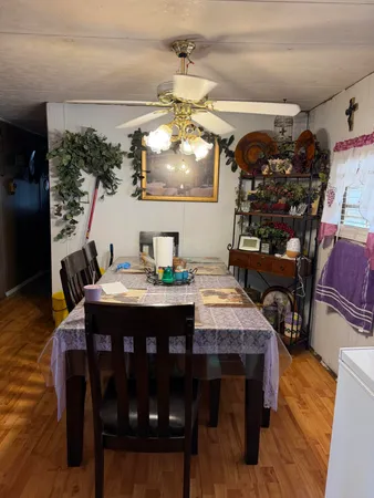 a view of a dining room with furniture and window