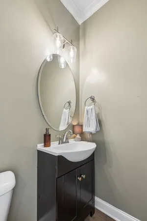 a bathroom with a sink vanity and a mirror