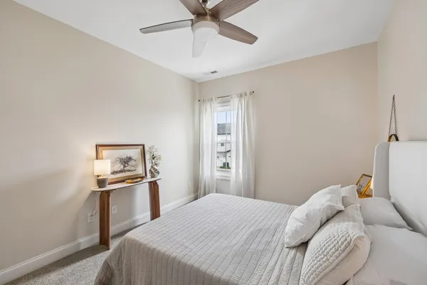 a bedroom with a bed and a cabinets