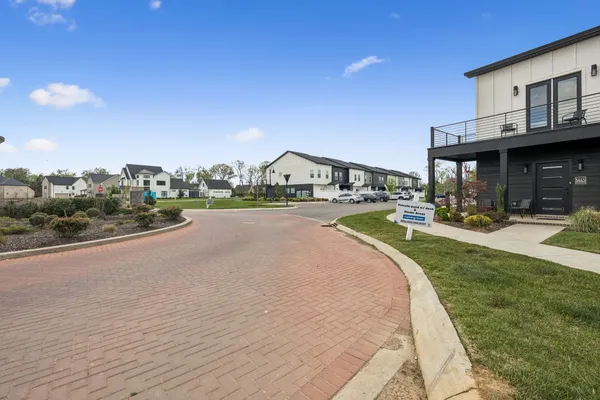 a view of a house with outdoor space and sitting area
