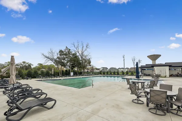 a view of a swimming pool with a patio