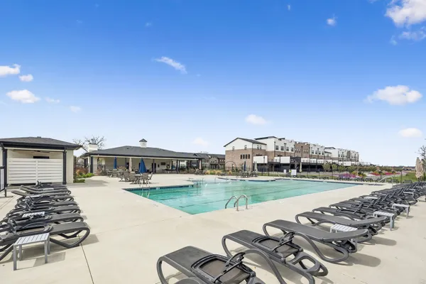 a view of a water fountain and a big yard