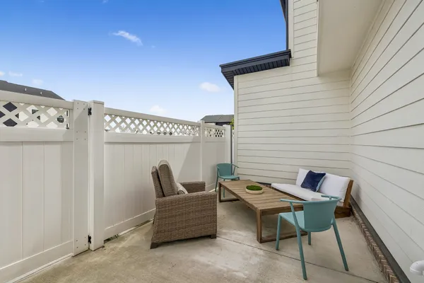 a view of a backyard with sitting area
