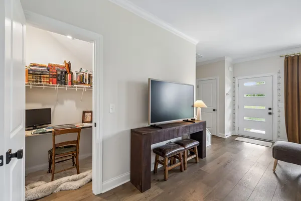 a workspace with furniture and wooden floor