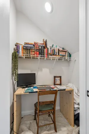 a view of a workspace with furniture