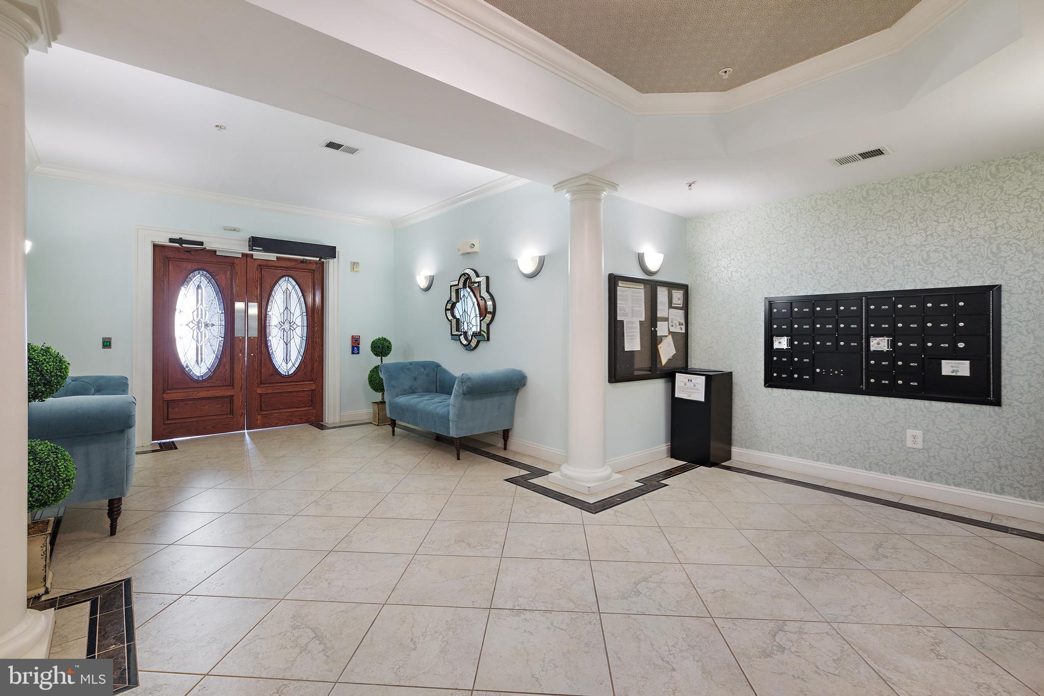 7335 Brookview Road, Unit 205 Elkridge, MD 21075 - Photo 4 of 31 Entrance lobby to condo bldg. and mailboxes