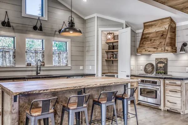 a kitchen with a stove and a sink