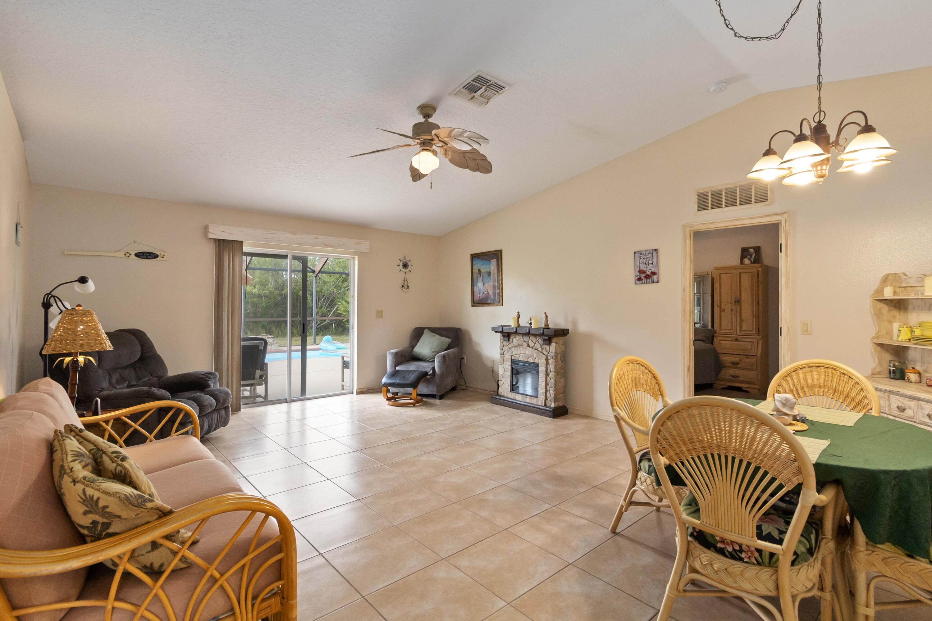 1364 Ran Road Southeast Palm Bay, FL 32909 - Photo 13 of 26 a bed room with a bed and furniture