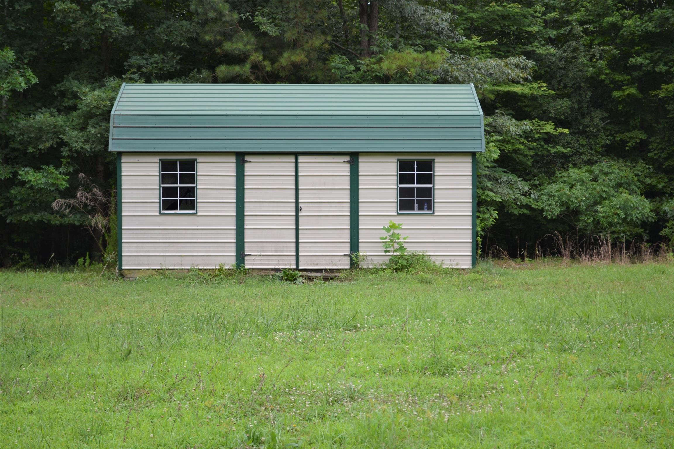 9699 Chestnut Ridge Road Lynchburg, TN 37352 - Photo 11 of 11 a front view of a house with a yard