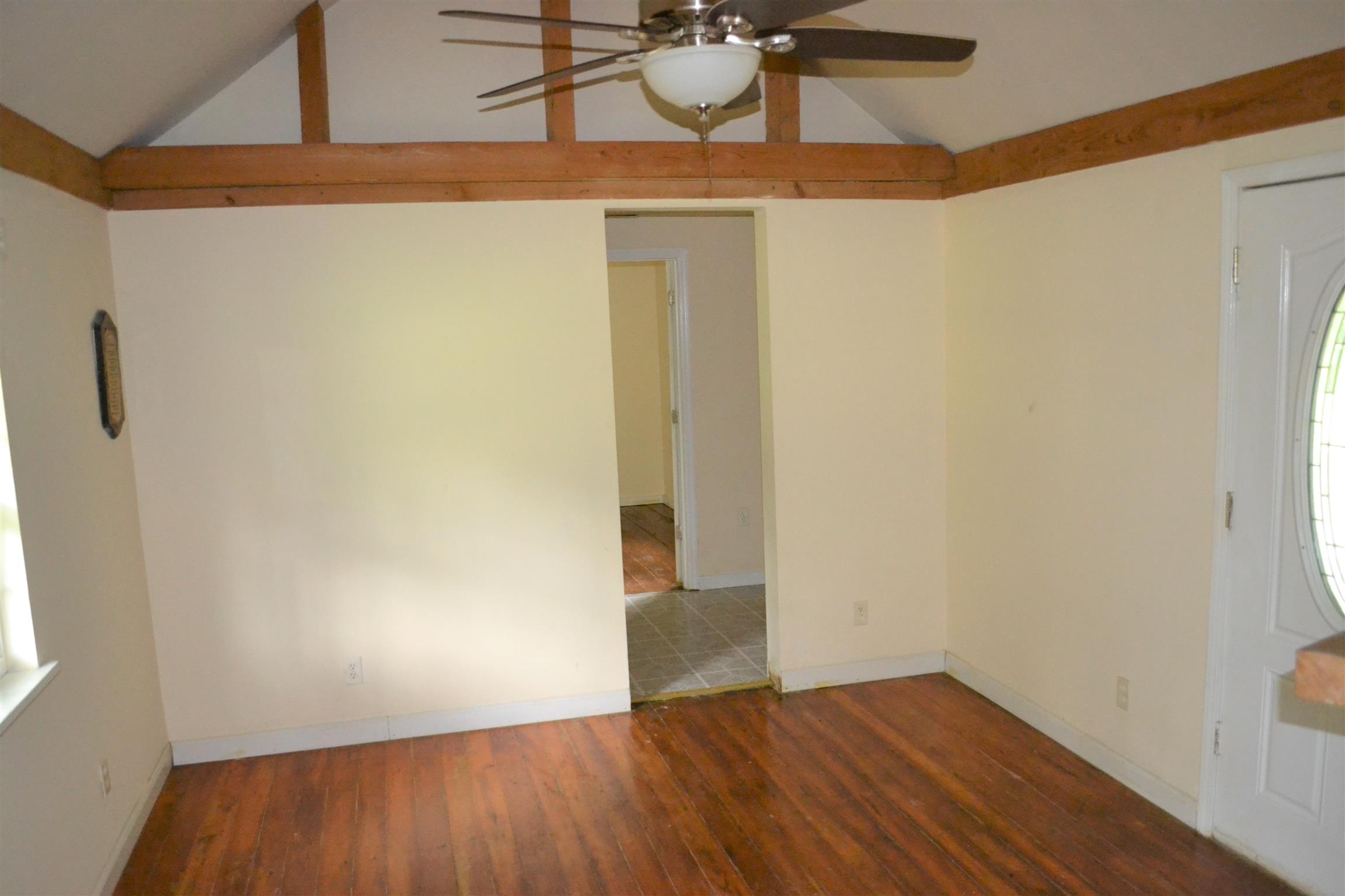 9699 Chestnut Ridge Road Lynchburg, TN 37352 - Photo 5 of 11 a view of an empty room with wooden floor