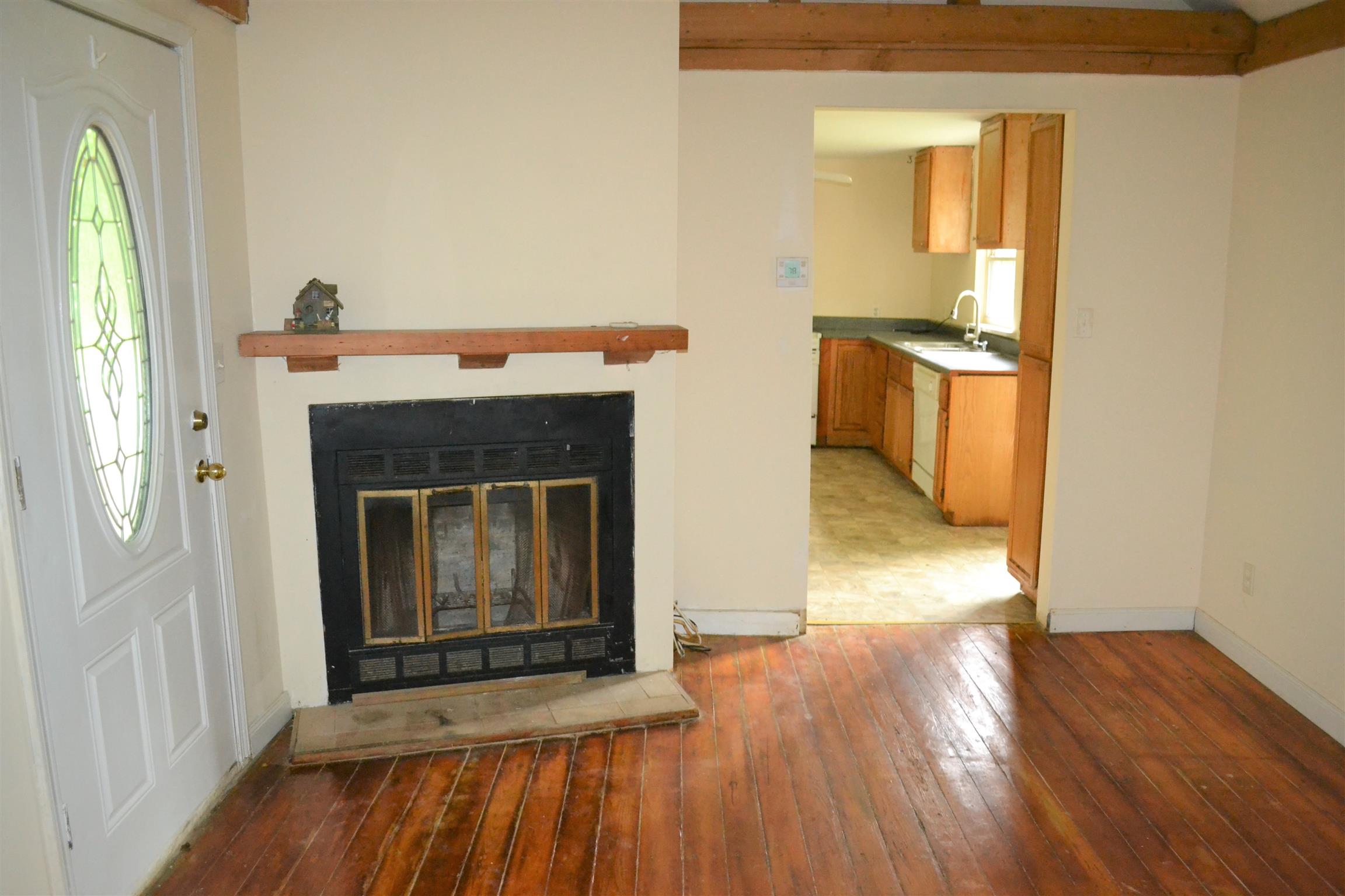 9699 Chestnut Ridge Road Lynchburg, TN 37352 - Photo 6 of 11 a view of a livingroom with wooden floor and a fireplace