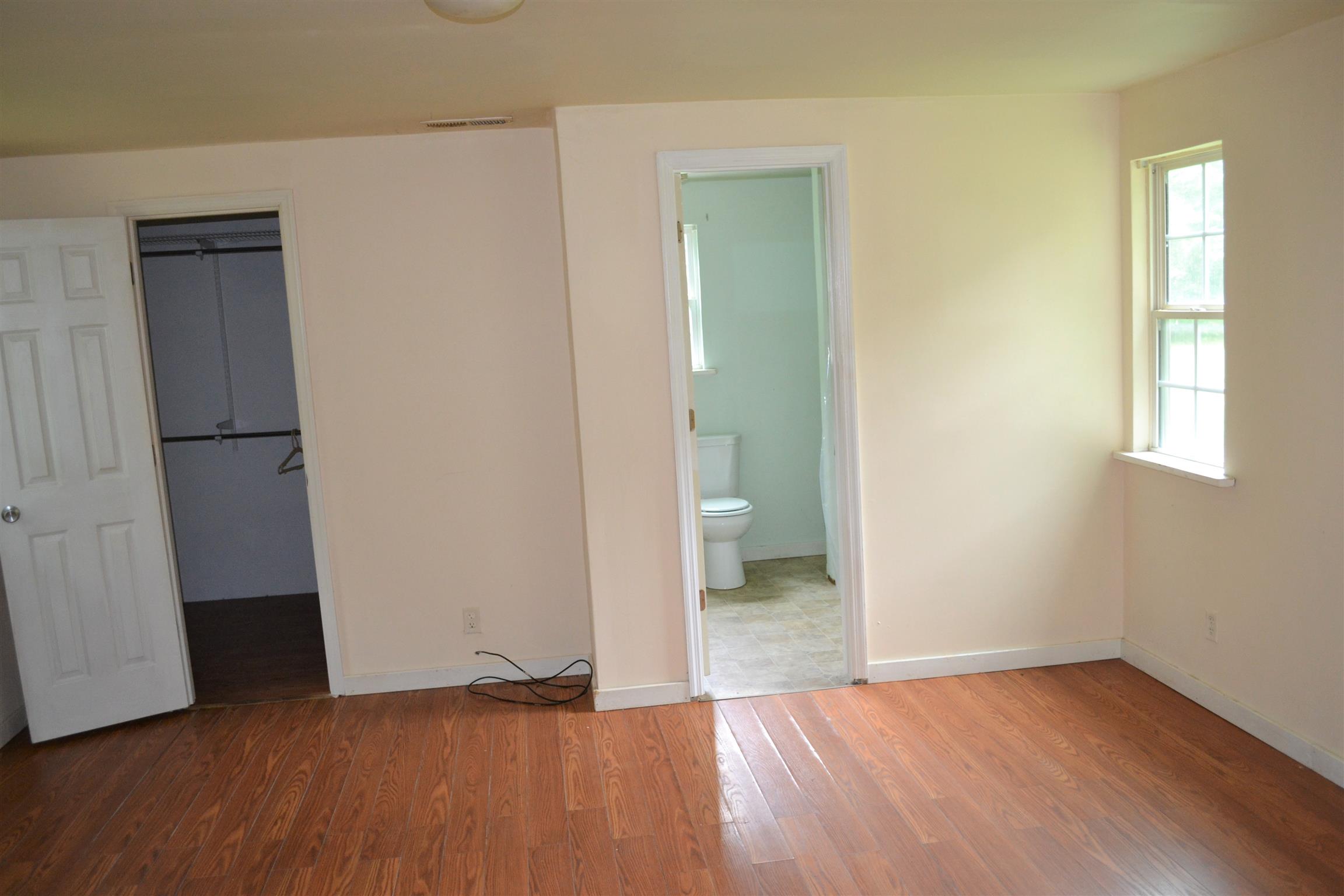 9699 Chestnut Ridge Road Lynchburg, TN 37352 - Photo 7 of 11 a view of wooden floor and windows in a room