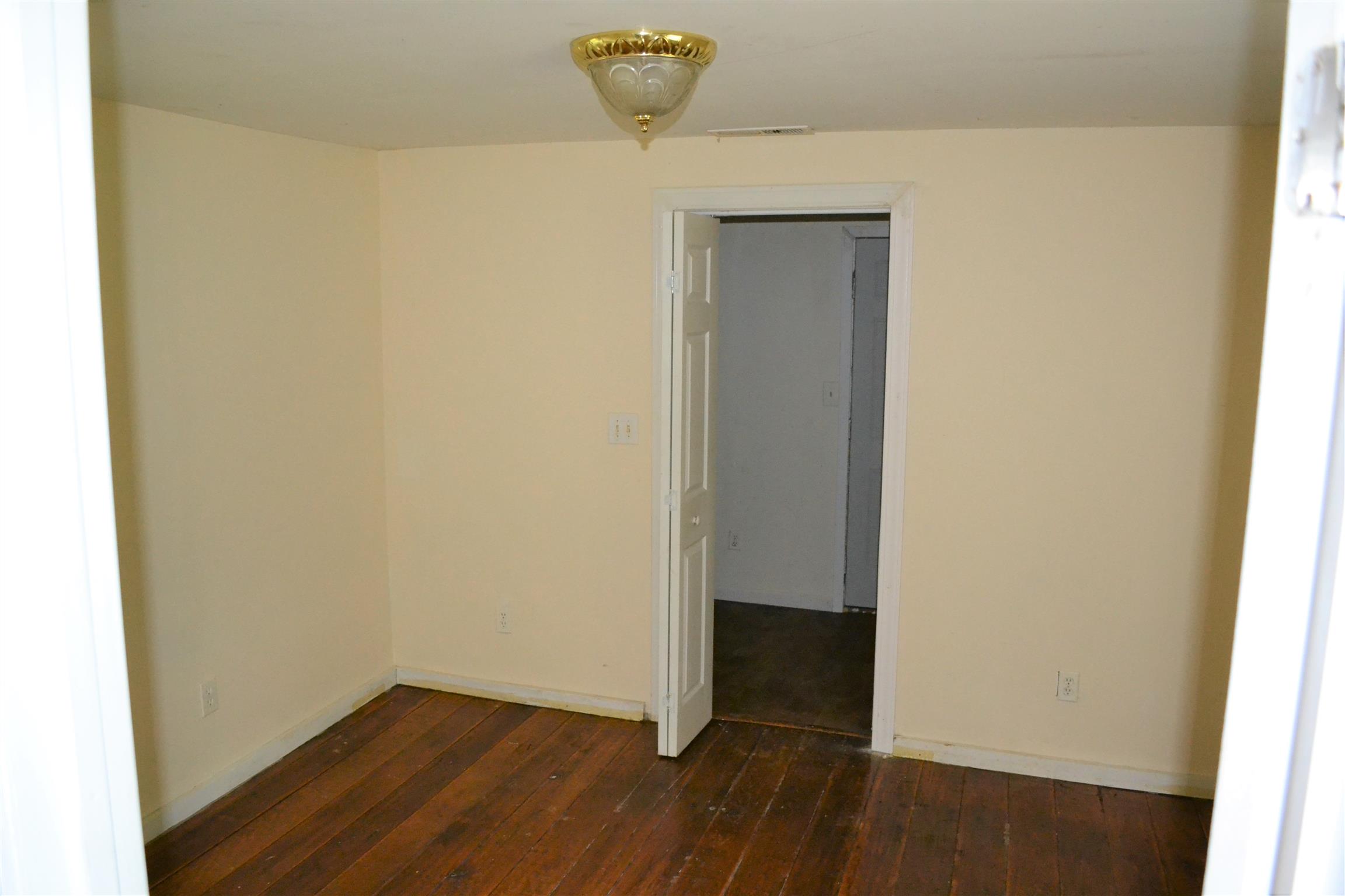 9699 Chestnut Ridge Road Lynchburg, TN 37352 - Photo 8 of 11 a view of empty room with wooden floor