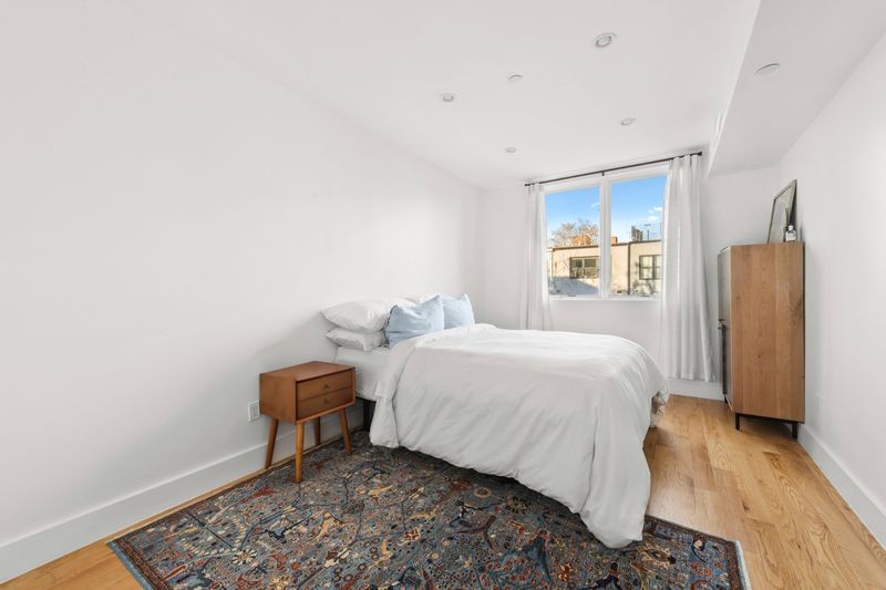 725 Lafayette Avenue, Unit 2B Brooklyn, NY 11221 - Photo 5 of 8 a bed room with a bed and a window