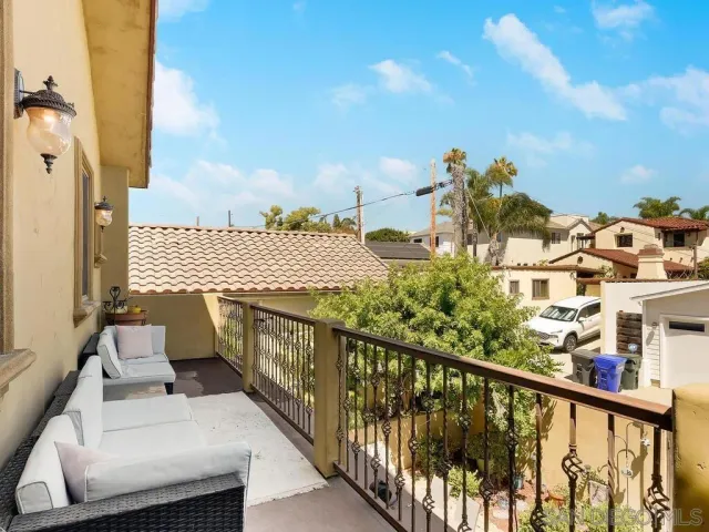 a view of balcony with furniture