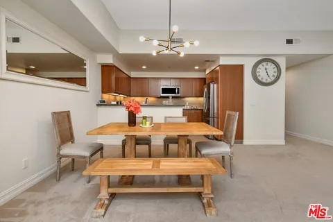 a bed room with a bed and a ceiling fan