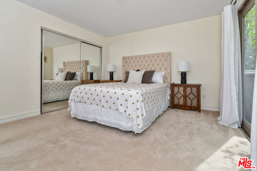 15248 Clark Street, Unit 104 Sherman Oaks, CA 91411 - Photo 22 of 48 a bedroom with a bed and a cabinets