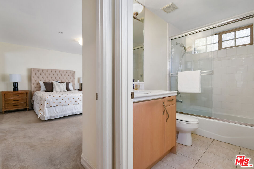 15248 Clark Street, Unit 104 Sherman Oaks, CA 91411 - Photo 24 of 48 a bathroom with a sink toilet and shower