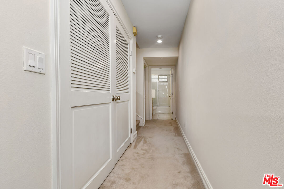 15248 Clark Street, Unit 104 Sherman Oaks, CA 91411 - Photo 26 of 48 a view of a hallway with wooden floor