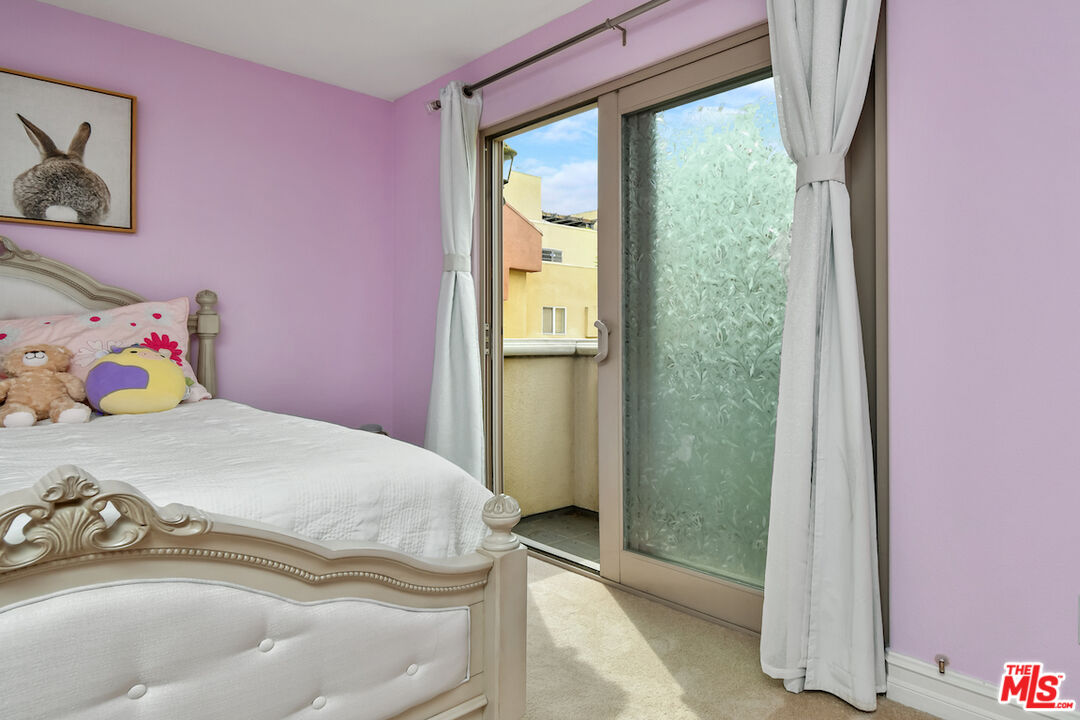 15248 Clark Street, Unit 104 Sherman Oaks, CA 91411 - Photo 32 of 48 a bedroom with a bed and a window