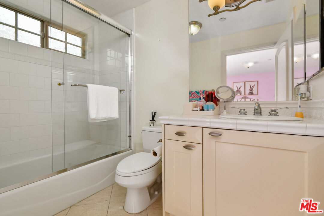 15248 Clark Street, Unit 104 Sherman Oaks, CA 91411 - Photo 34 of 48 a bathroom with a sink a toilet and shower