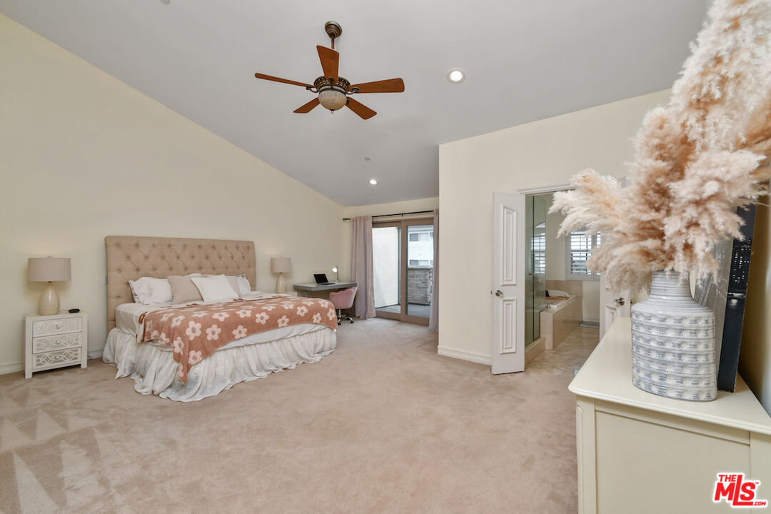 15248 Clark Street, Unit 104 Sherman Oaks, CA 91411 - Photo 37 of 48 a bed room with a bed and a chandelier