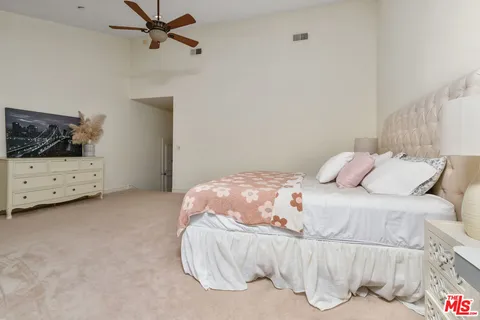a bathroom with a double vanity sink and mirror with shower