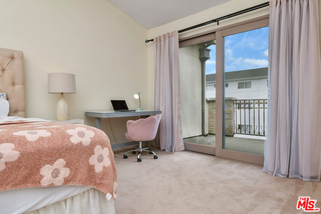 15248 Clark Street, Unit 104 Sherman Oaks, CA 91411 - Photo 45 of 48 a bedroom with a bed and a window