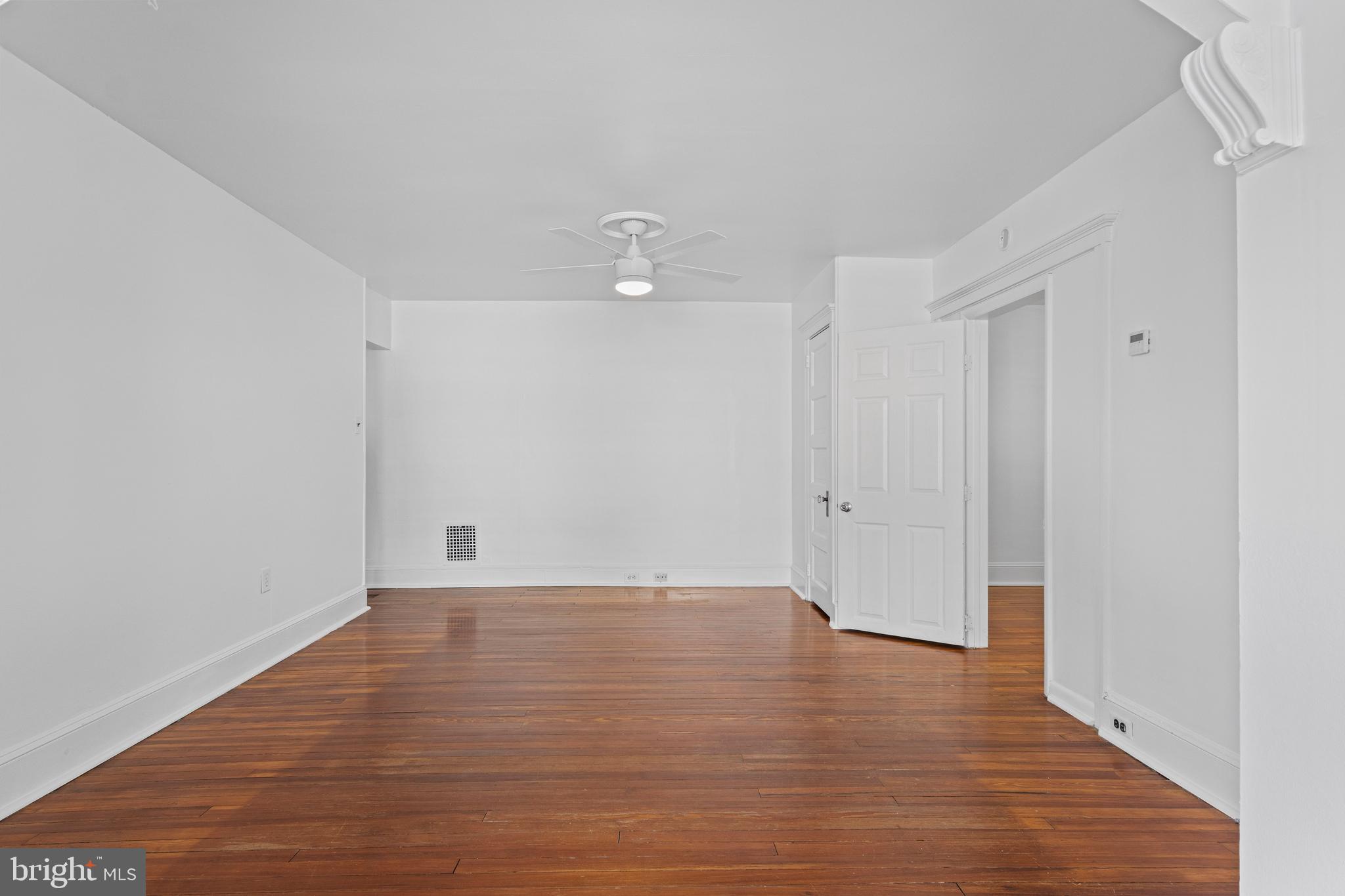 153 Conestoga Road Wayne, PA 19087 - Photo 10 of 13 a view of an empty room with wooden floor