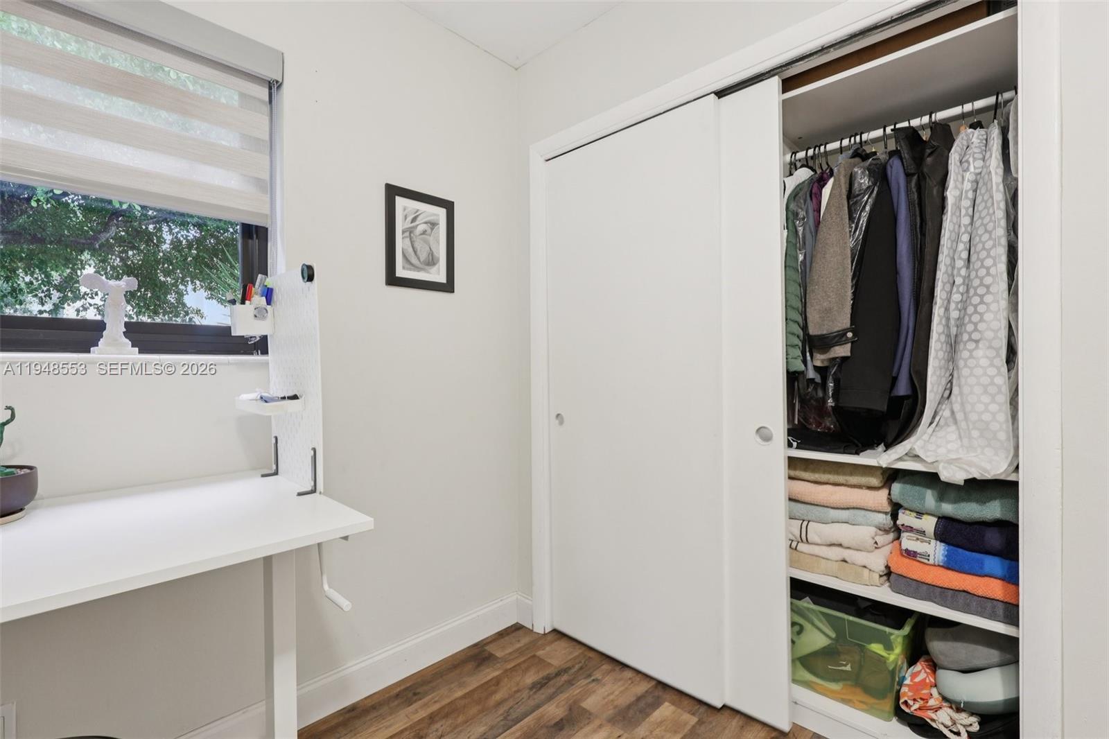 5301 Pierce Street Hollywood, FL 33021 - Photo 21 of 45 a view of walk in closet with clothes and shoes