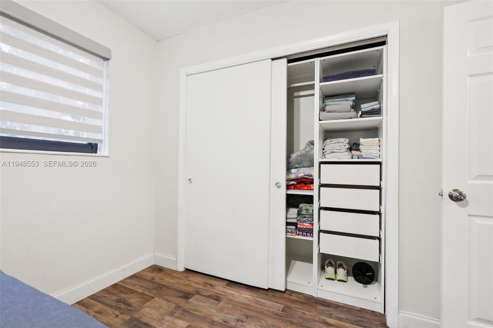 5301 Pierce Street Hollywood, FL 33021 - Photo 22 of 45 a view of a bedroom with wooden floor and closet