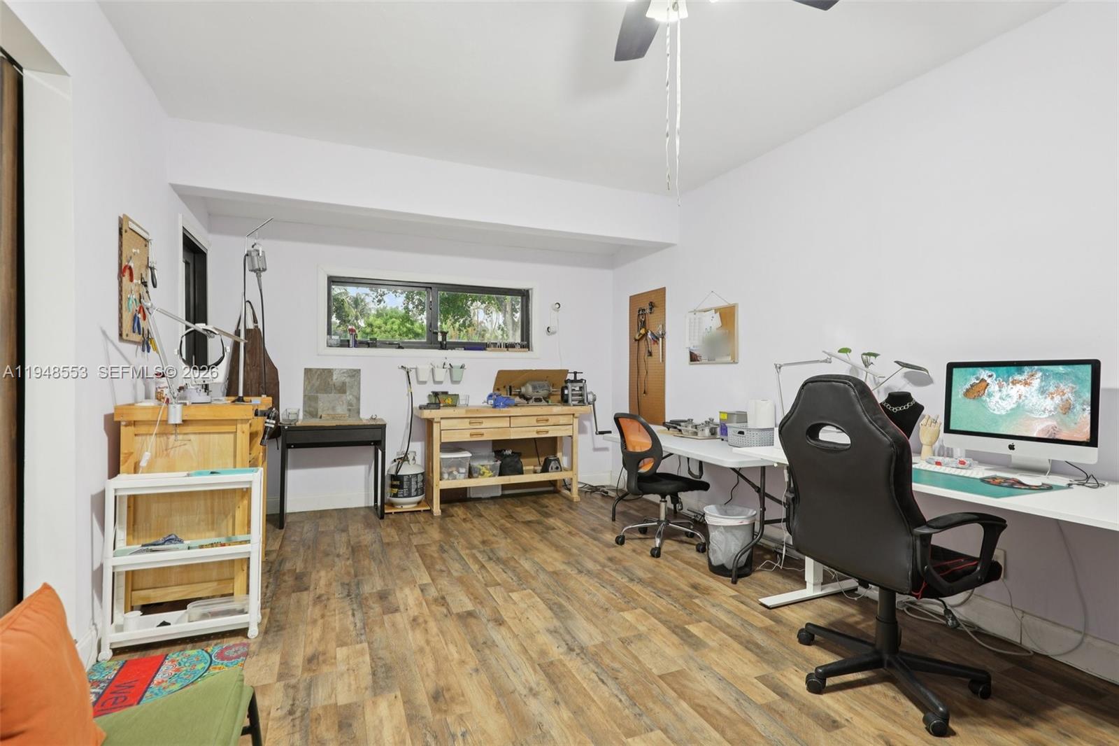 5301 Pierce Street Hollywood, FL 33021 - Photo 33 of 45 a view of a workspace with furniture and a window