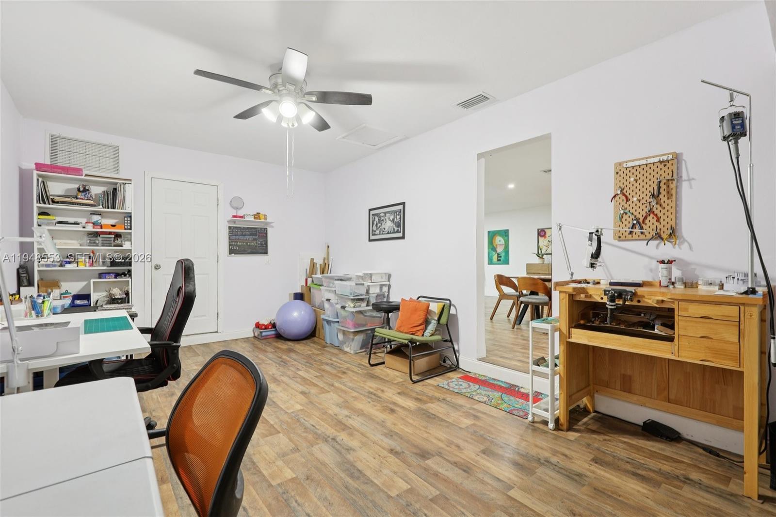 5301 Pierce Street Hollywood, FL 33021 - Photo 34 of 45 a view of a workspace with furniture and a window