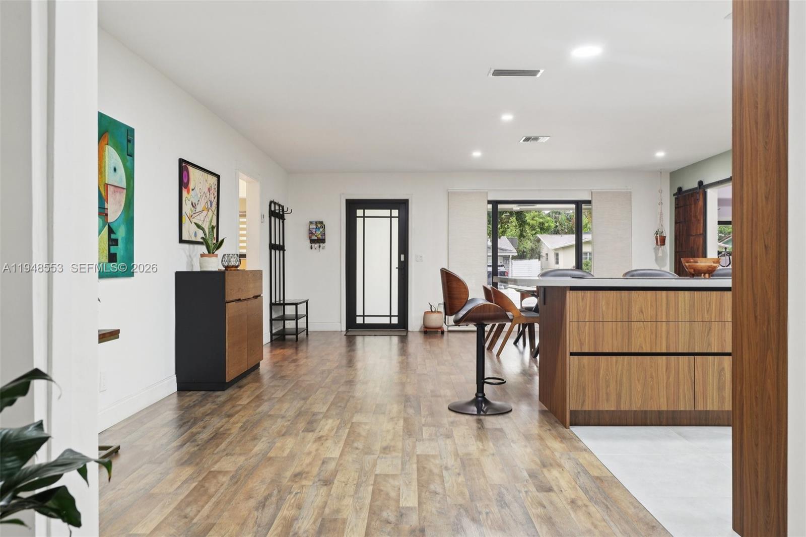 5301 Pierce Street Hollywood, FL 33021 - Photo 10 of 45 a livingroom with furniture a window and wooden floor