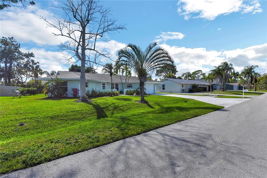 2328 Clipper Way Naples, FL 34104 - Photo 40 of 44 a view of a park with large trees