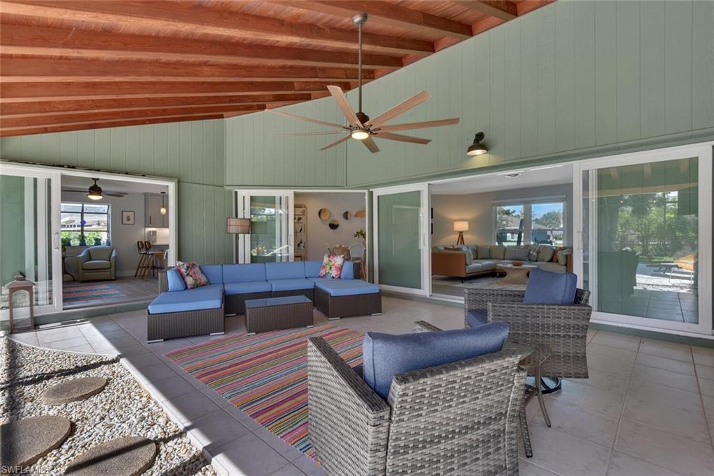 2328 Clipper Way Naples, FL 34104 - Photo 5 of 44 a living room with furniture and a ceiling fan