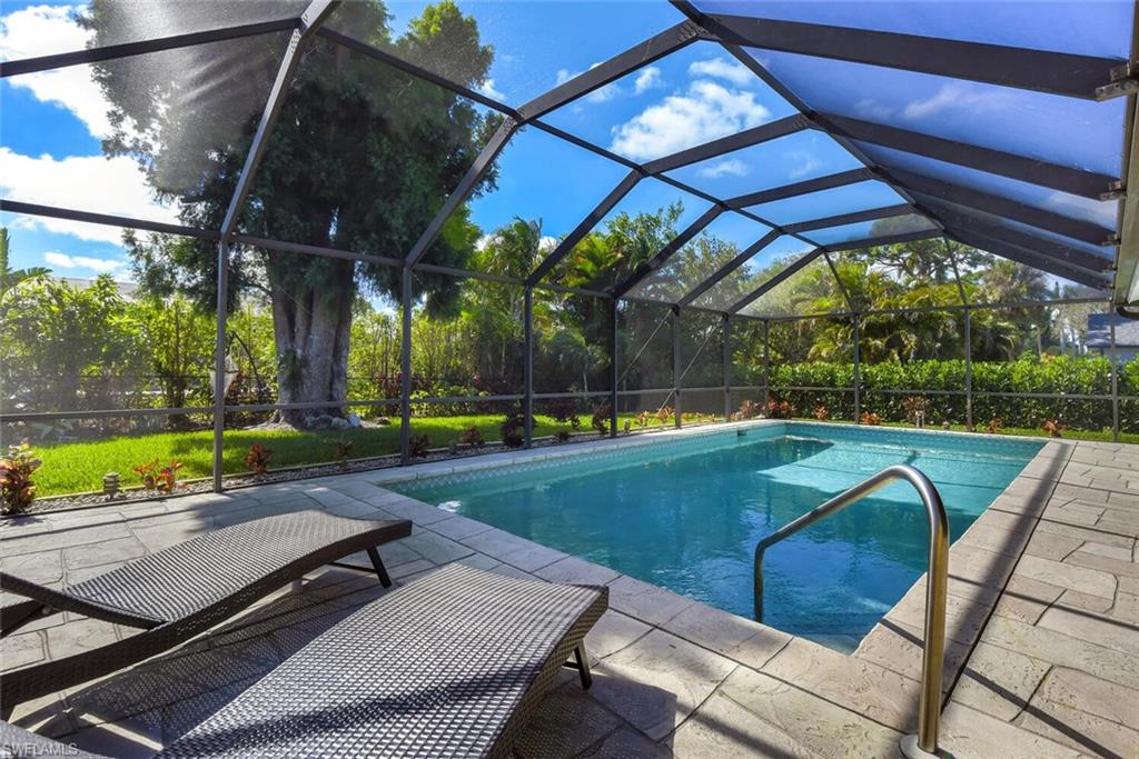 2328 Clipper Way Naples, FL 34104 - Photo 7 of 44 a view of a backyard with swimming pool
