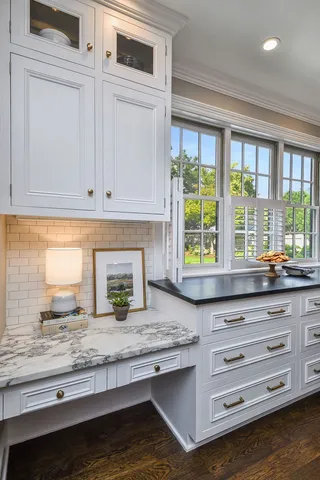 a bathroom with a sink toilet and mirror