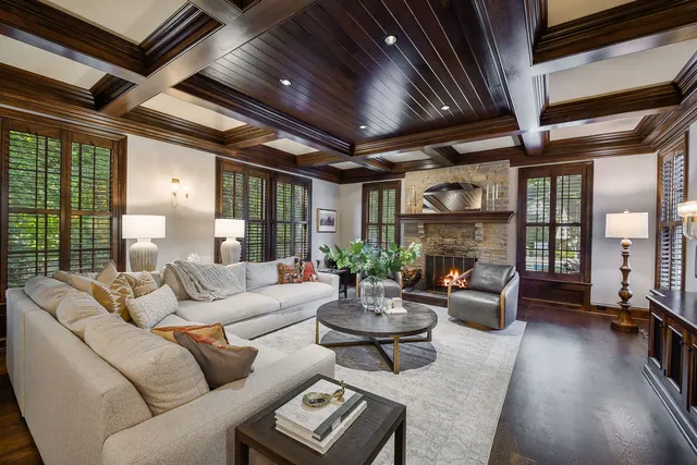 a bedroom with a bed couch and a large window