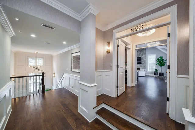 a spacious bedroom with a bed and a window