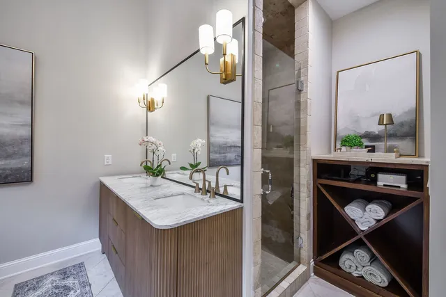 a view of a workspace with furniture and stairs