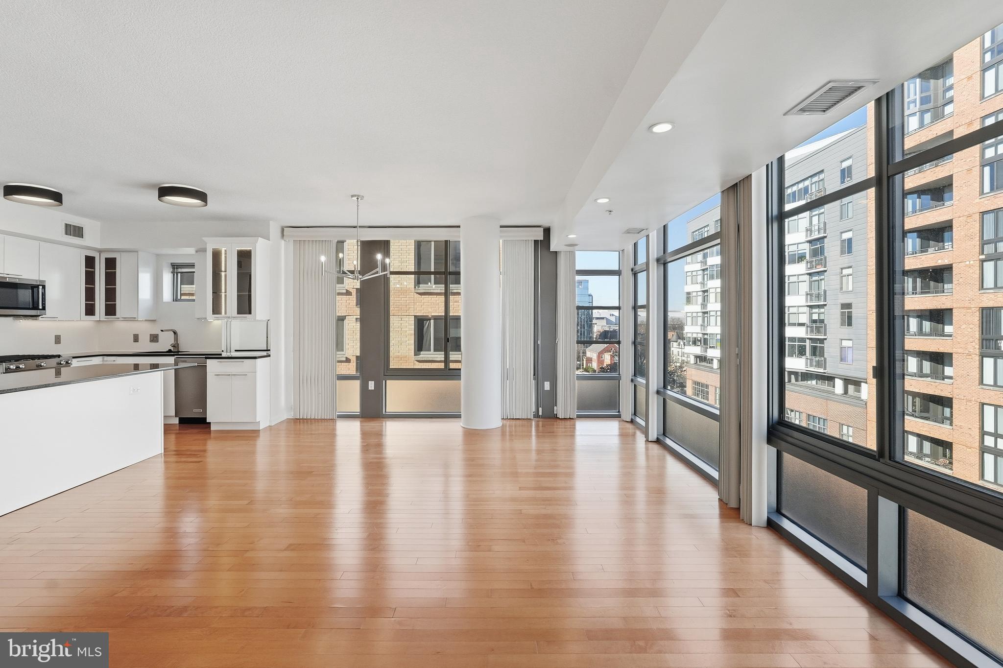 440 L Street Northwest, Unit 805 Washington, DC 20001 - Photo 15 of 38 a view of an entryway with wooden floor and a kitchen