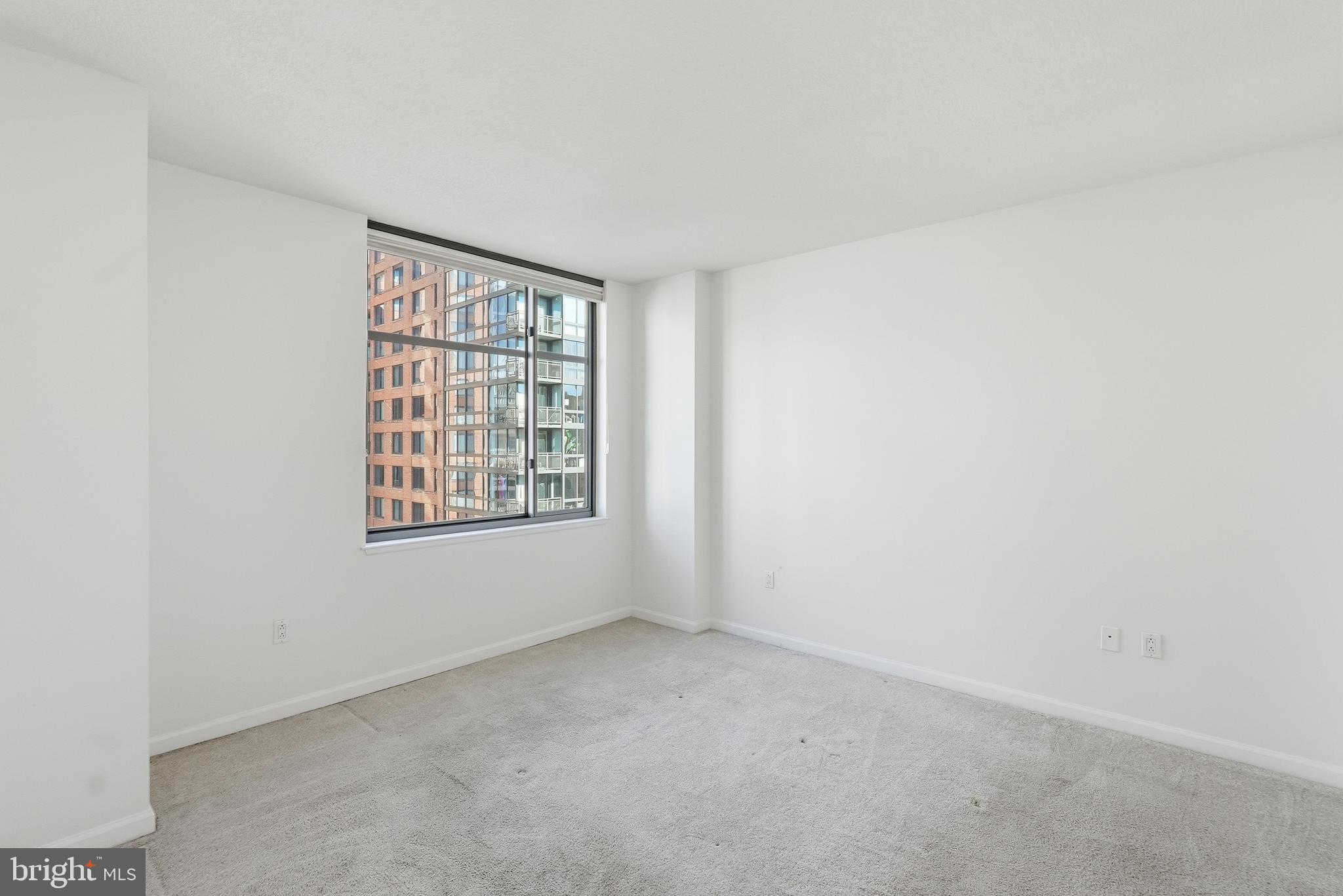 440 L Street Northwest, Unit 805 Washington, DC 20001 - Photo 20 of 38 a view of an empty room with a window