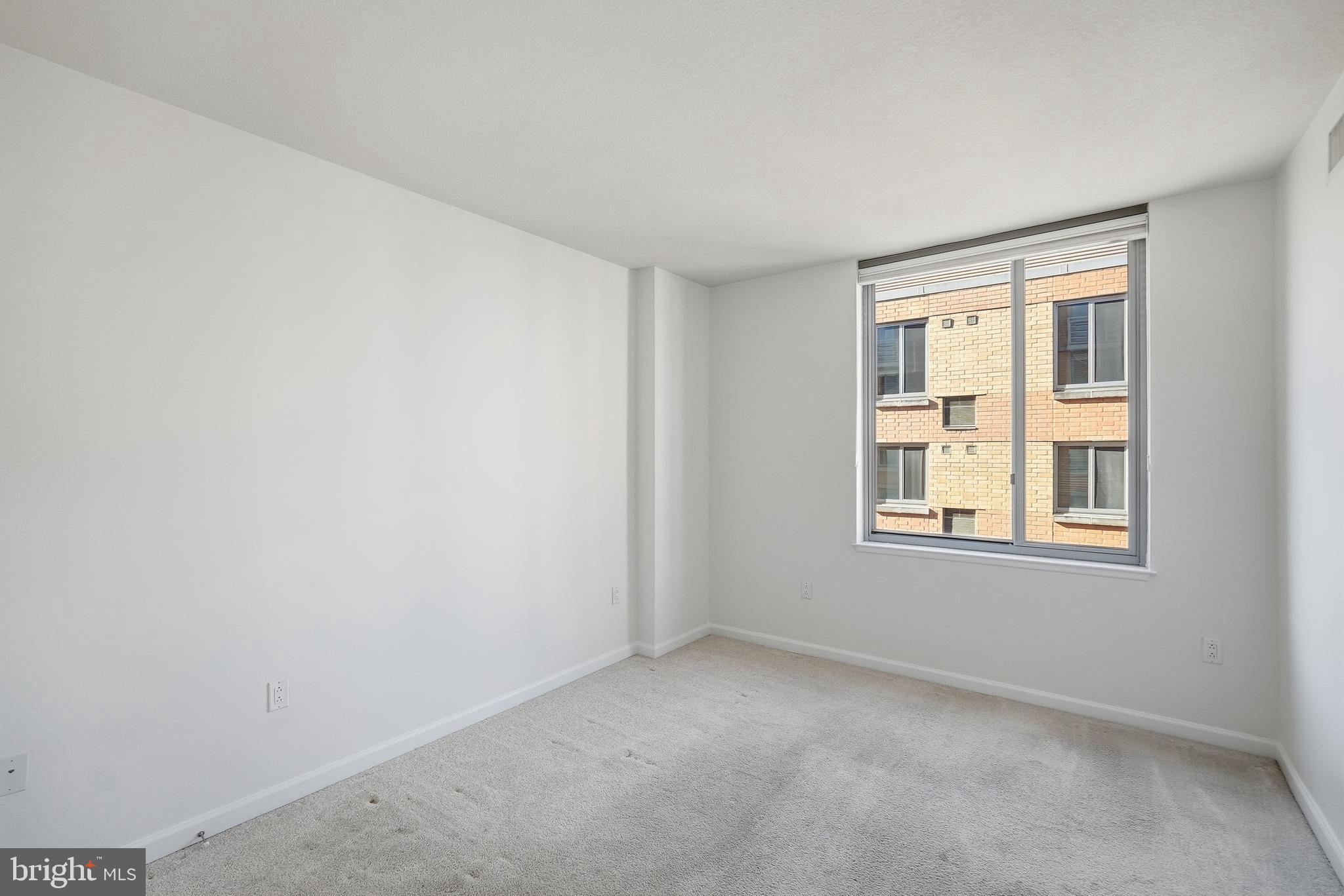 440 L Street Northwest, Unit 805 Washington, DC 20001 - Photo 26 of 38 an empty room with a window
