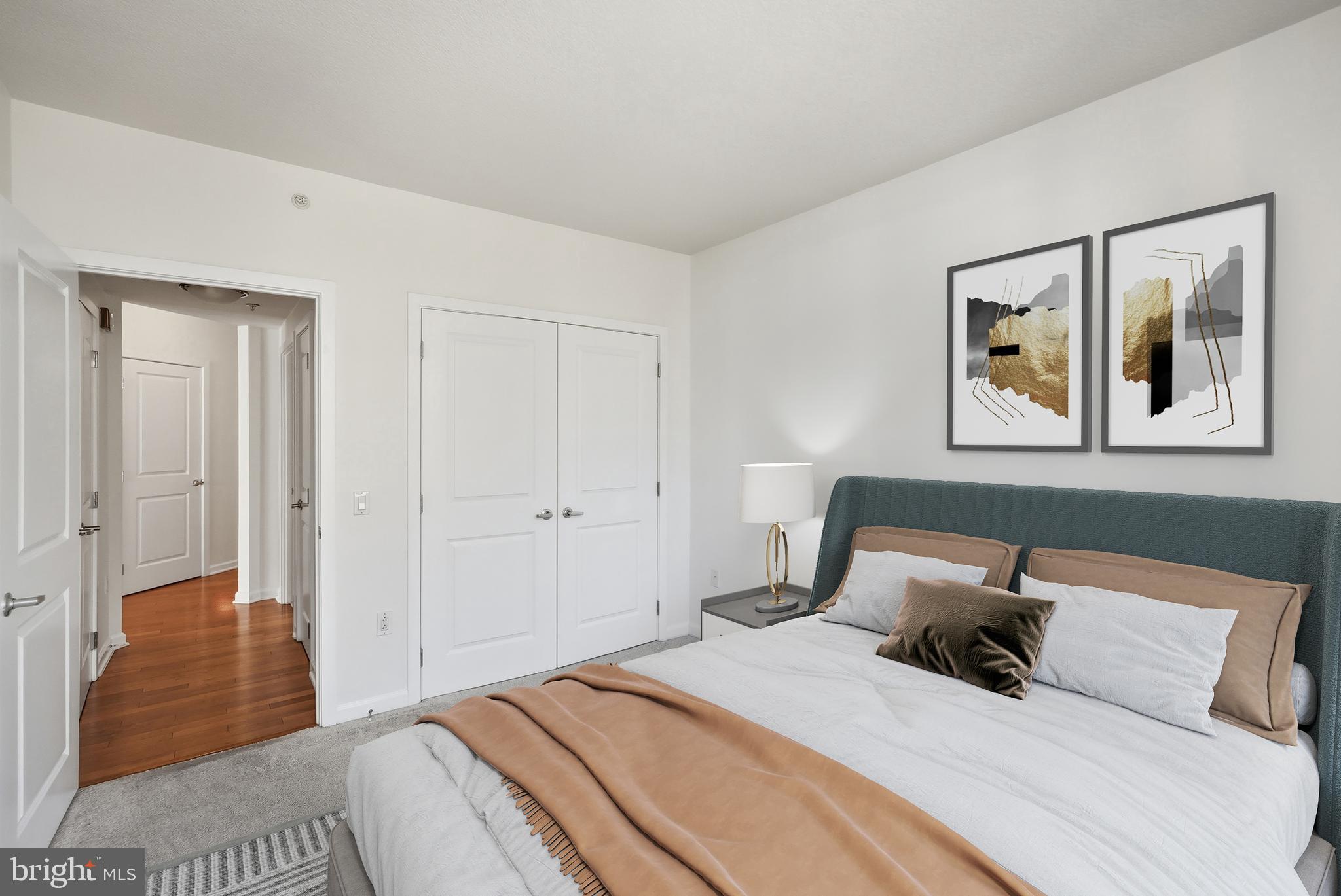 440 L Street Northwest, Unit 805 Washington, DC 20001 - Photo 27 of 38 a bedroom with a bed and a painting on the wall